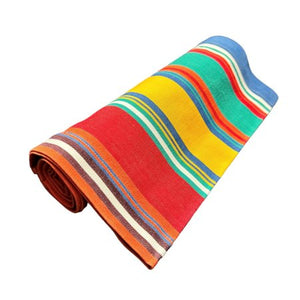 Rolled-up colorful table runnerl on a white background