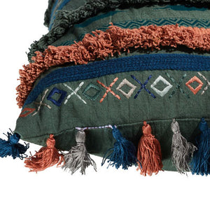 Decorative pillow with colorful tassels and embroidery on a white background