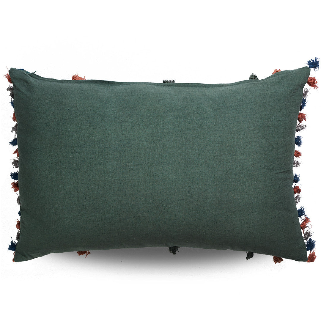 Decorative pillow with tribal patterns and fringes on a white background