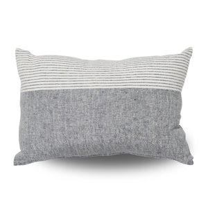 Two-tone pillow with striped top and solid bottom on a white background