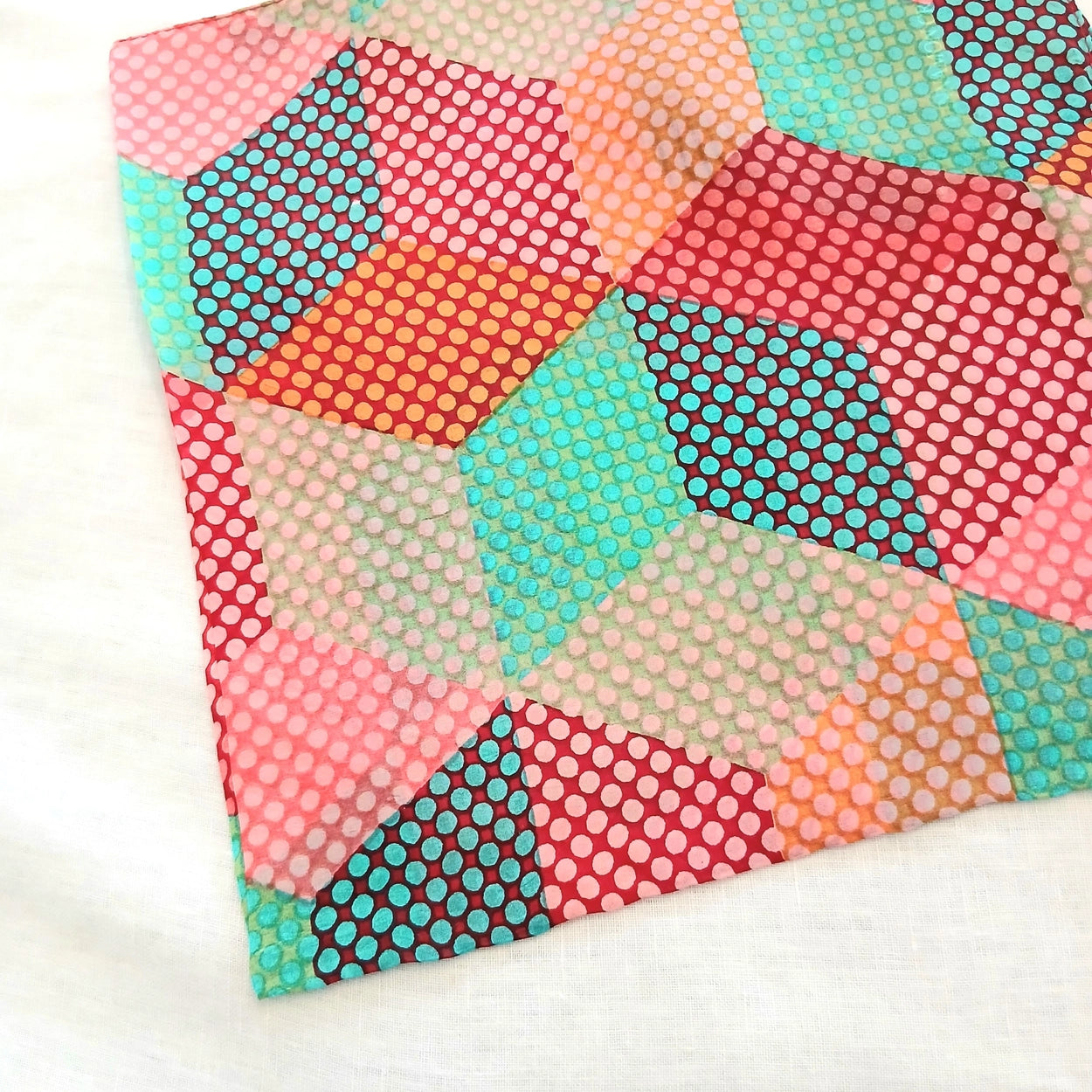 Colorful geometric patterned fabric on a white background