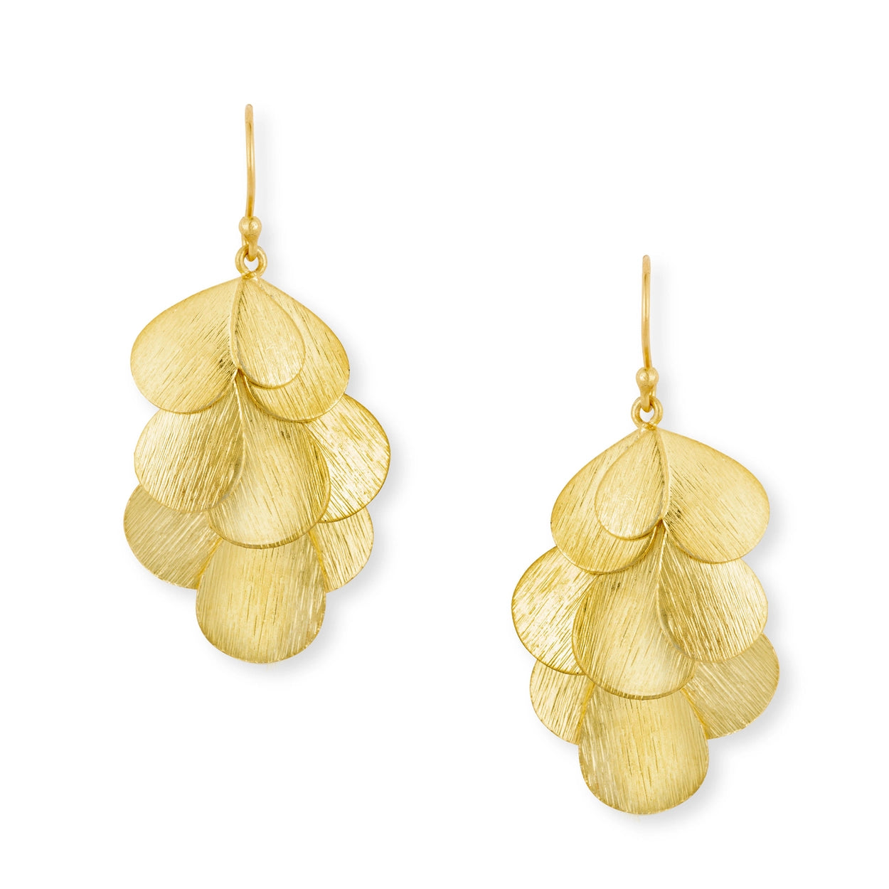 Gold leaf-like earrings on a white background