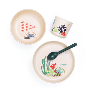 Set of children's dishes with underwater-themed designs on a white background
