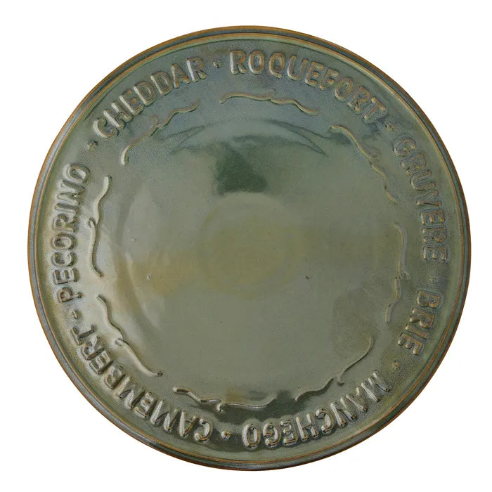 Round ceramic tray with embossed text on a white background