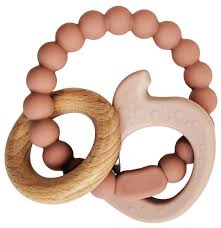 Teething ring with wooden and silicone elements on a white background