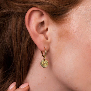 Starlight huggies-Gold hoops with star patterned discs-Cubic Zirconia on hoops-Shown on model
