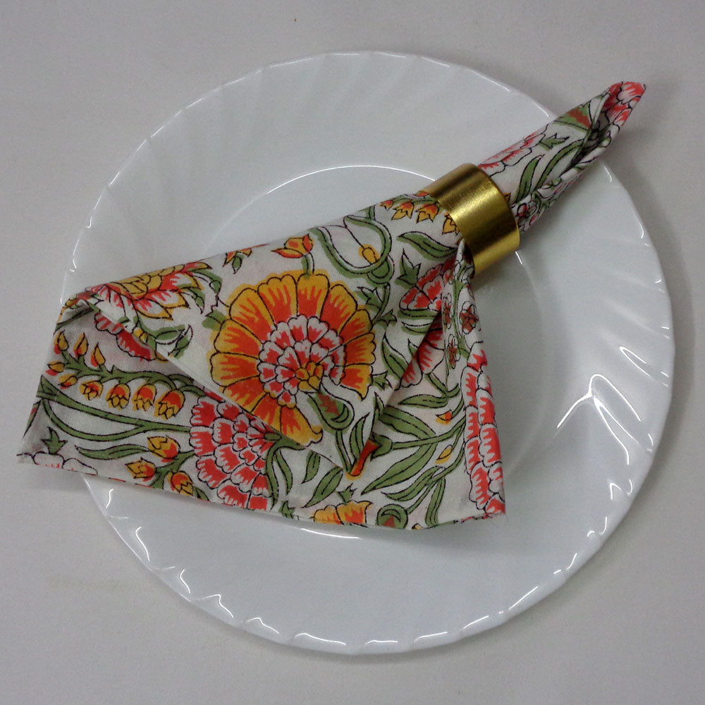 Four floral-patterned fabric Napkins on a white background