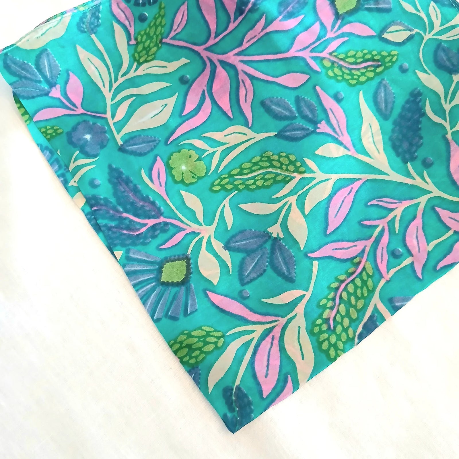 Turquoise floral scarf on a white background