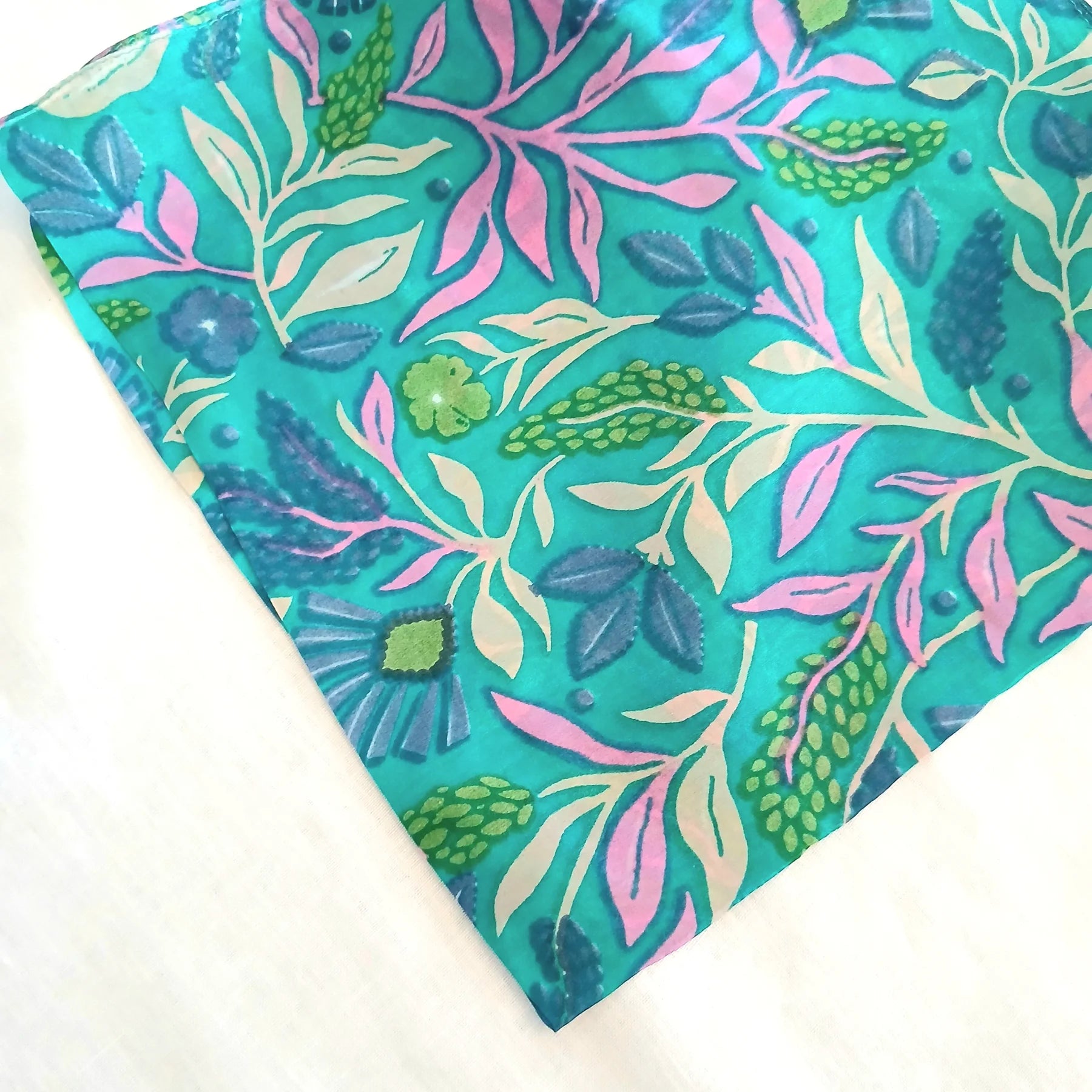 Turquoise floral scarf on a white background