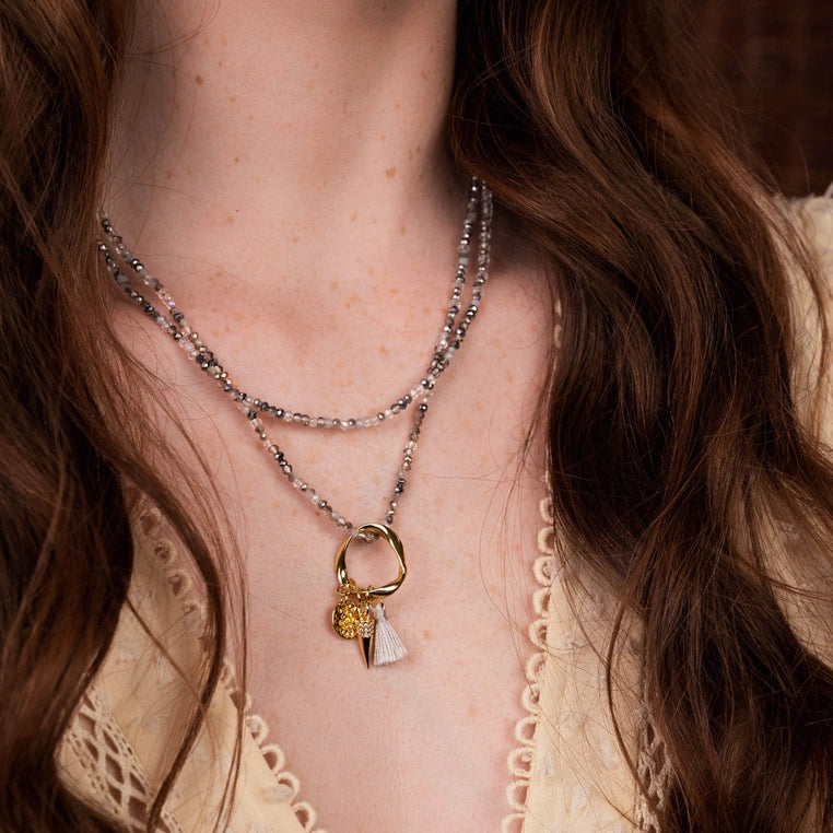 Sabina Necklace-Grey Crystals-Ring Pendant with tassels and charms-Flatlay close up