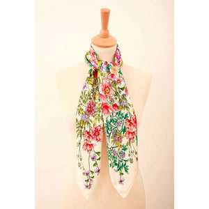 Floral scarf on a mannequin against a beige background