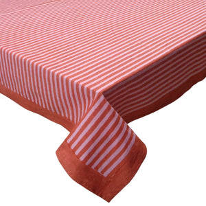 Red and pink striped tablecloth on a white background