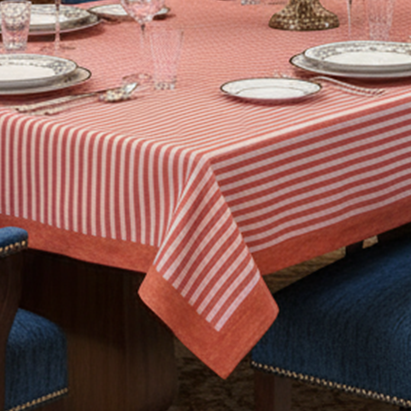 Red and pink striped tablecloth on a white background