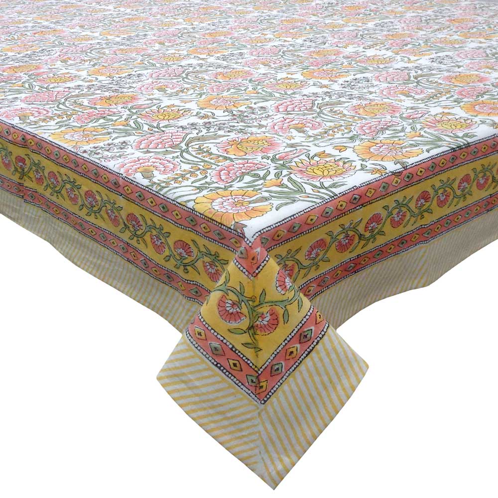 Colorful floral patterned tablecloth with a yellow border on a white background